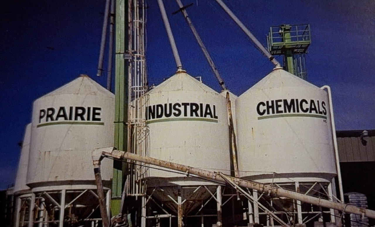 Prairie Industrial Chemicals-branded vats at an early facilities site